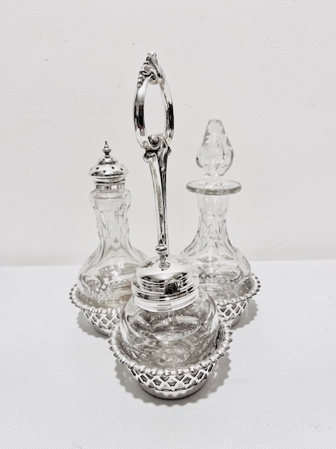 Antique Silver Plated and Glass Three Bottle Cruet