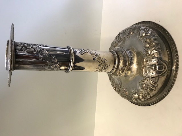 Substantial antique silver plated single candlestick decorated with an open mouthed figure (c.1880)