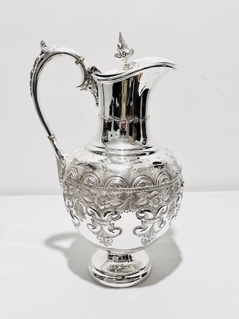 Antique Silver Plated Claret Jug with Heavily Embossed Bulbous Body