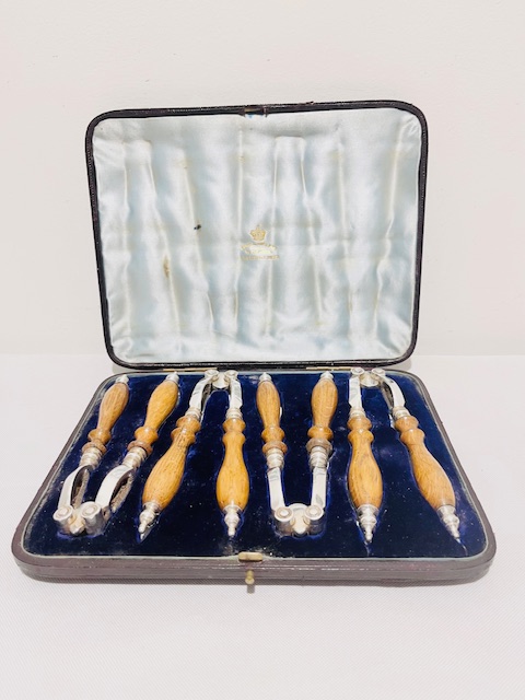 Boxed Set of Four Antique Silver Plated and Oak Nut Crackers