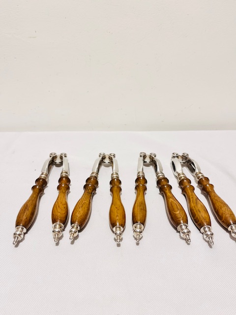 Boxed Set of Four Antique Silver Plated and Oak Nut Crackers