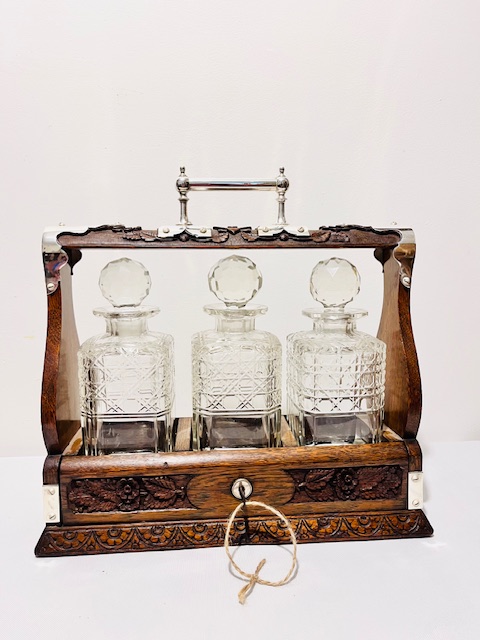 Antique Silver Plated and Carved Oak Tantalus (c.1910)