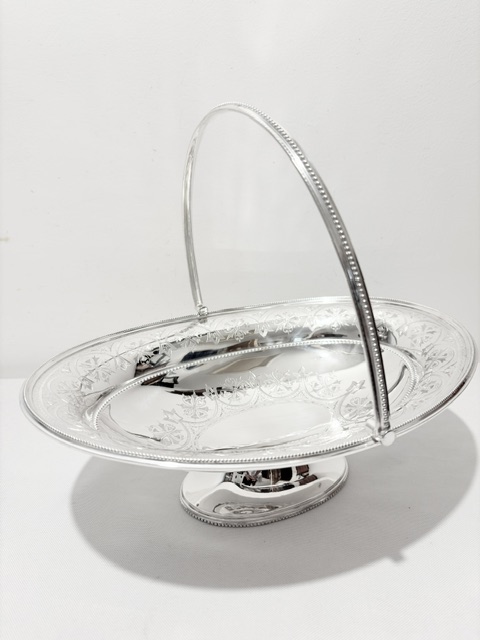Antique Silver Plated Oval Bread Fruit Basket with Swing Handle Antique Silver Plated Oval Bread Fruit Basket with Swing Handle