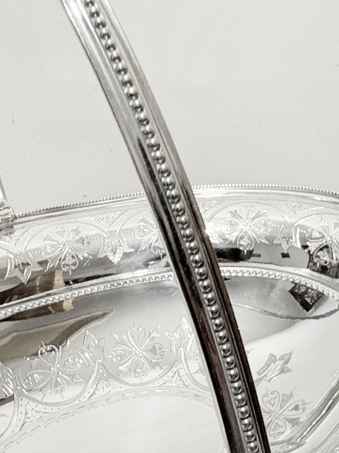 Antique Silver Plated Oval Bread Fruit Basket with Swing Handle Antique Silver Plated Oval Bread Fruit Basket with Swing Handle