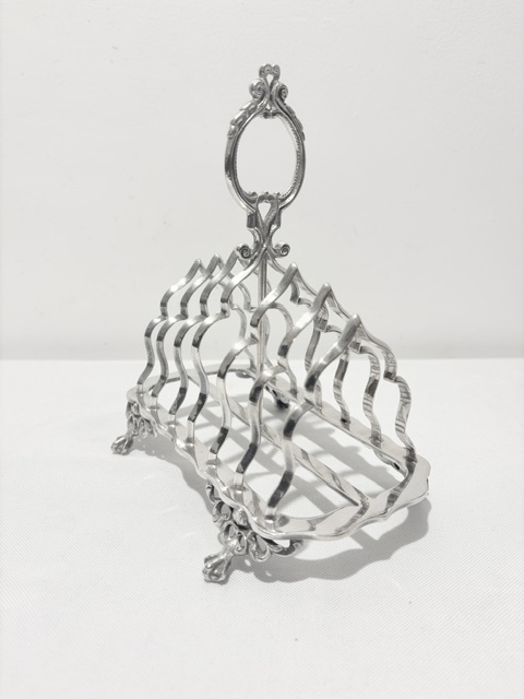 Antique Silver Plated Toast Rack with Central Ornate Handle Antique Silver Plated Toast Rack with Central Ornate Handle