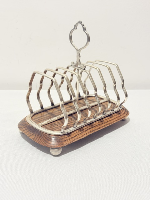 Antique Silver Plated and Oak Toast Rack on Four Ball Feet Antique Silver Plated and Oak Toast Rack on Four Ball Feet